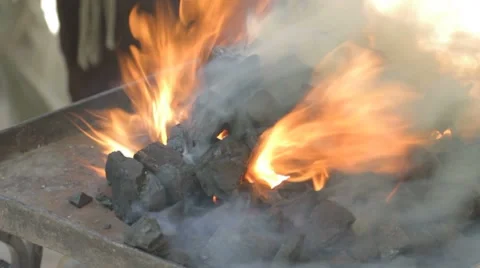 Close-up of fire flames from live coals blacksmith forge outdoors. Stock-Footage 7769212