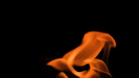 Close-up of fire flames moving and flickering in darkness. Glowing heat and Stockbeeldmateriaal 345833039