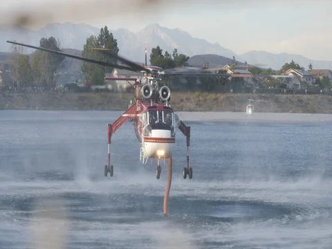 Close Up of Fire Helicopter filling up water tank Stock Footage