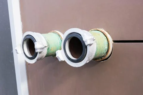 Close-up of fire hydrants on the wall of the building to connect to a fire en Stock Photos