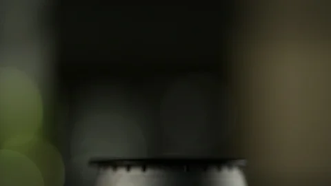 Close-up fire lights up on a gas burner stove in the kitchen at home Stock Footage 113613530