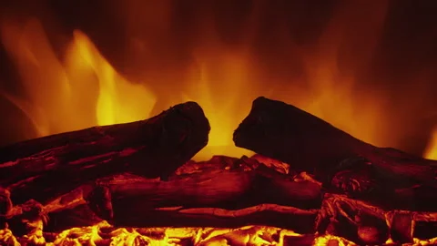 Close-up of a fire showing burning logs and bright yellow-orange flames Stock Footage 277872106