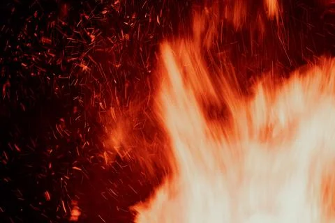 Close-up of fire sparks flying in a dynamic pattern Stock Photos