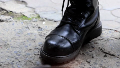 Close-up of firefighter boots through flames Stock Footage 287980305