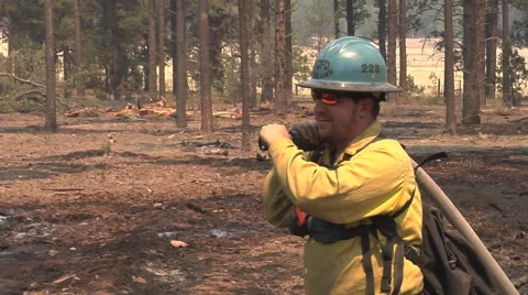 Close-up of Firefighter with hose overshoulder Video stock 40750505