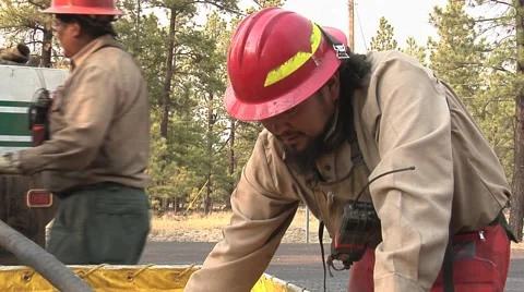 Close-up Firefighter pumping water out of container Stock Footage 40752417