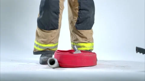 Close-up of a firefighter’s boots standing on a rolled fire hose Vídeos de archivo 326218533