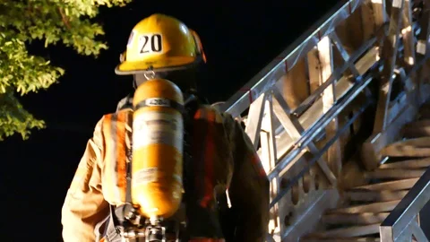Close-up of firefighters on truck Stock Footage 116018521