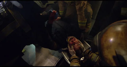Close Up Of Fireman Carrying Man To Safety Stock Footage 143546170