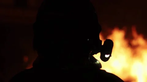 Close up of fireman with fire at night Stock Footage 316753946
