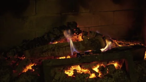 A close up of fireplace burning in a grill in slow motion and flames Stock Footage 219464493