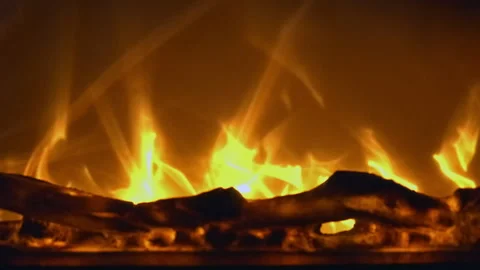 Close-up of a fireplace fire abstract flames warm orange background Stock Footage 323079233