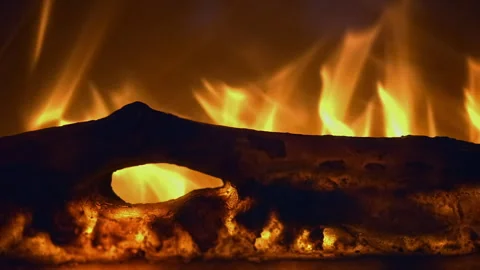 Close-up of a fireplace fire abstract flames warm orange background a conce.. Video stock 323079250