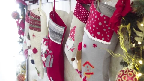 Close up of fireplace with socks and Christmas decorations Video stock 101992737