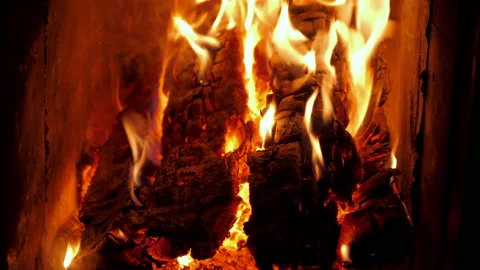 Close up of firewood burning in fires. A log fire crackling in the fireplace. Stock Footage