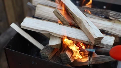 Close-up firewood flames from fire. Night bonfire, logs are on fire, sparks fly Stock Footage 241017977