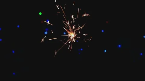 Close-up of firework sparkler burning. Fireworks burn on a black background. Stock Footage 145613325