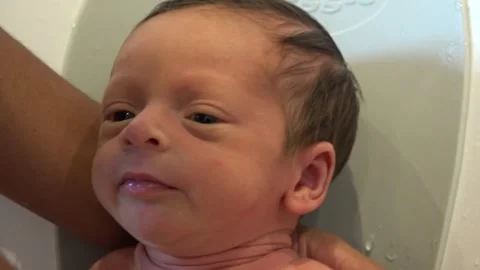 Close Up, First Bath, New Born Baby, Mixed race, Mother and child Stock Footage 253101690