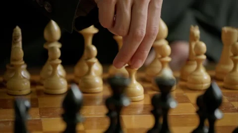 Close Up of First Chess Move on Wooden Board with Female Hand Vídeos de archivo 346104809