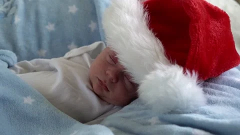 Close-up First Days Of Life Newborn Cute Funny Sleeping Baby In Big Santa Claus Stock Footage 165808342