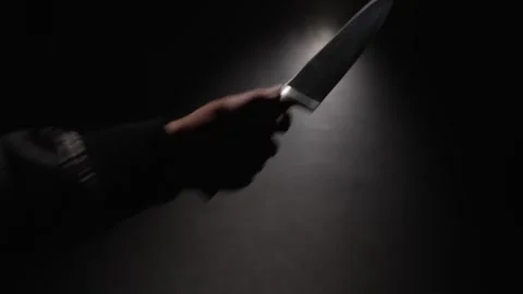 Close-up first person view of hand raising sharp knife and stabbing Stock Footage 321007503