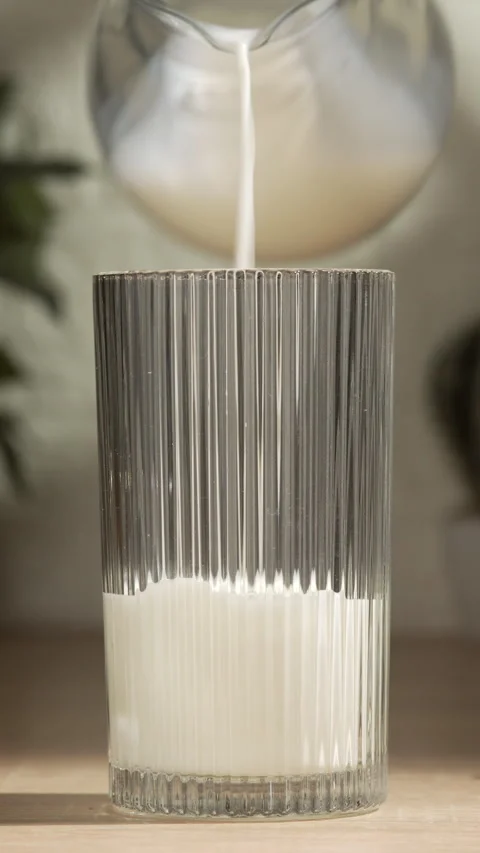 Close-up of the first step in making a summer cocktail. Fresh white milk is.. Stock Footage 335148016