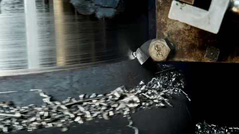 Close-up of first turning of a metal cylindrical detail on a lathe with a tool Stock Footage 117429768