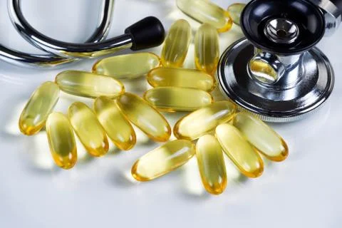 Close up of fish oil capsules for good health on white background Stock Photos