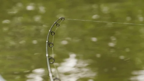 Close up of fishing wire being threaded in fishing rod, Tortuguero, Costa Rica Stock Footage 141251552