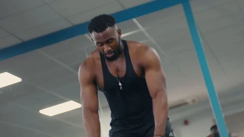Close up of fitness model using heavy ropes in the gym, intense workout Stock Footage 89577497