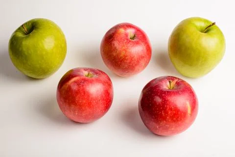 Close-up: five apples on a white background. Stock Photos