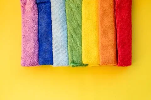 Close-up of five overlapping microfiber cleaning clothes of different colors Stock Photos