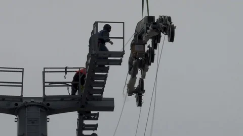 Close-up of fixing multi-ton metal structure on support with helicopter Ka-32 Stock Footage 106111284