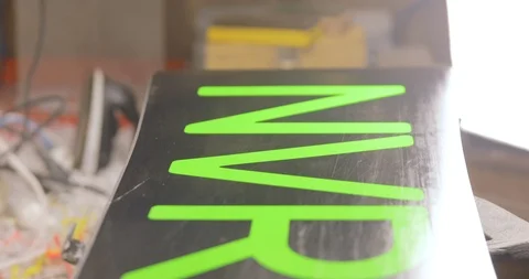 Close Up Of Fixing Snowboard Surface, Waxing, Polishing. Stock Footage 125857620