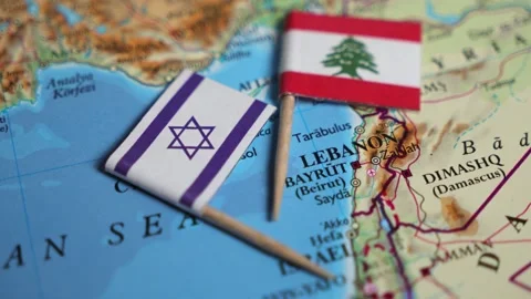 Close-up of the flag of Israel and the flag of Lebanon on a map Stock Footage 288325691