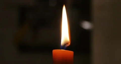 Close up on the flame of a burning candle in the darkness Stock Footage 152366102