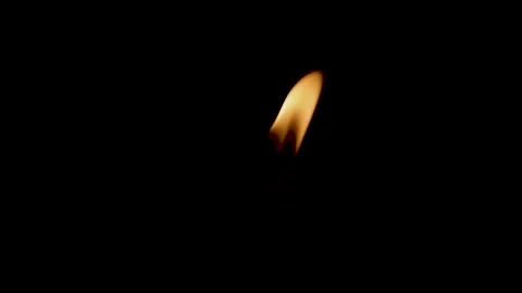 Close-up of the flame burning on the candle with isolated on a black background. Stock Footage 159085047