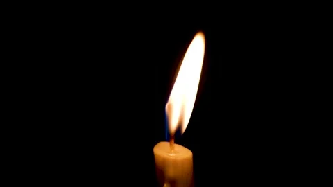 Close-up of the flame burning on the candle with isolated on a black background. Stock Footage 159085518