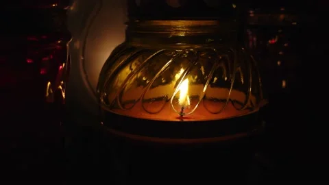 Close-up of the flame of the candle burning on the grave. Video stock 233970345