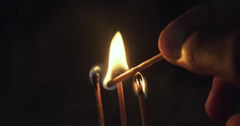Close up flame, fire and burning match heads on dark background. Stock Footage 305478107