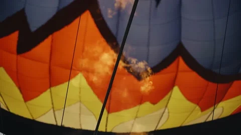 Close-up of a flame lifting a balloon into the air Stock Footage 170585902
