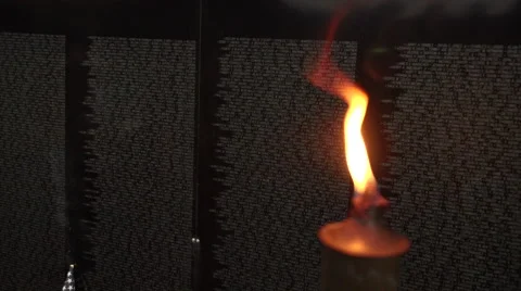 Close up of flame next to Vietnam Wall That Heals. Stock Footage 47392859