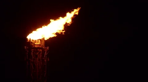 Close-up flame oil refinery at night Stock Footage 56142575