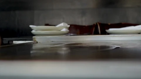 Close up flames being lit on an open grill at a restaurant. Kitchen food prep  Stock Footage 102057609