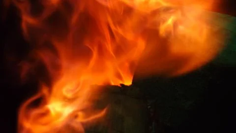 Close Up of flames burning on black background Stock Photos