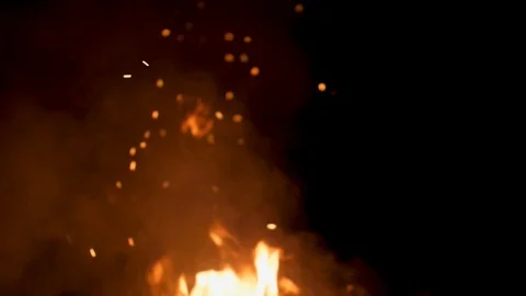Close up of flames burning with sparks at night, camp fire Stock Footage 124076908
