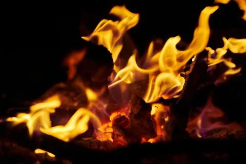 Close-up of flames of fire and burning wood in the fireplace Stock Photos