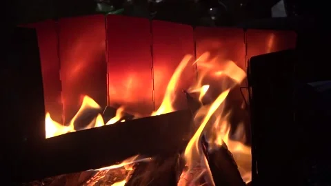 Close-up, flames from fire. Night bonfire, logs are on fire, sparks fly. Stock Footage 161897637