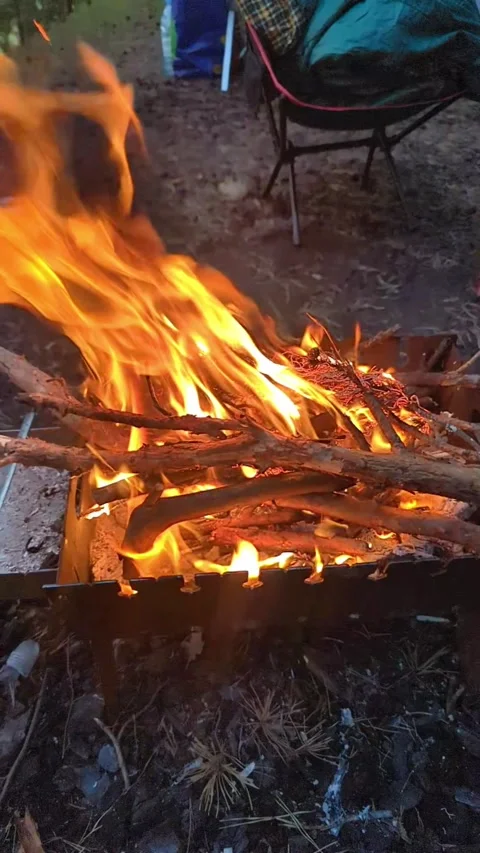 Close-up, flames from fire. Night bonfire, logs are on fire, sparks fly. 4k, Stock Footage 341668877