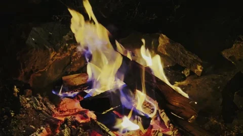 Close-up, flames from the fire. Night fire, burning wood, flying sparks. Stock Footage 220030937